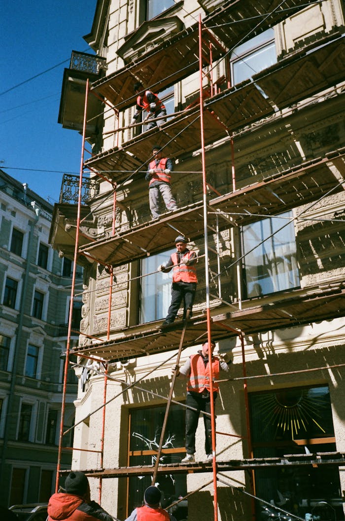 Men on Brown Scaffolding